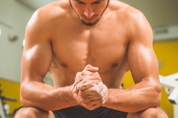 Male doing exercises in the gym