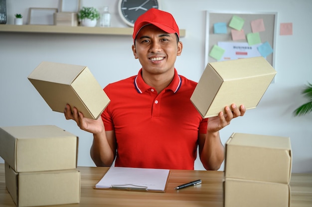 Male employee authenticates customers to deliver parcels in office