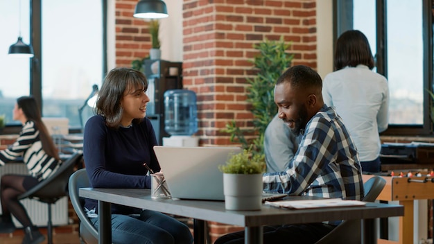 Male employee greeting female candidate at job interview to discuss about hiring and business career. HR recruiter interviewing woman in office, attending job offer and recruitment meeting.