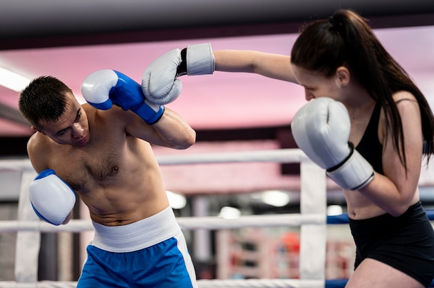 Male and female boxers training together