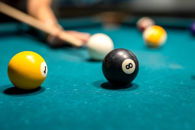 Male or female hand taking the shot at pool