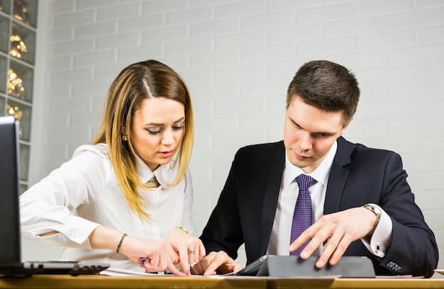 Male and female office workers.