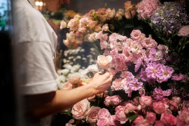 Male florist making a beautiful bouquet