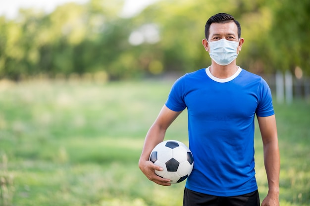 Male football player in a medical mask