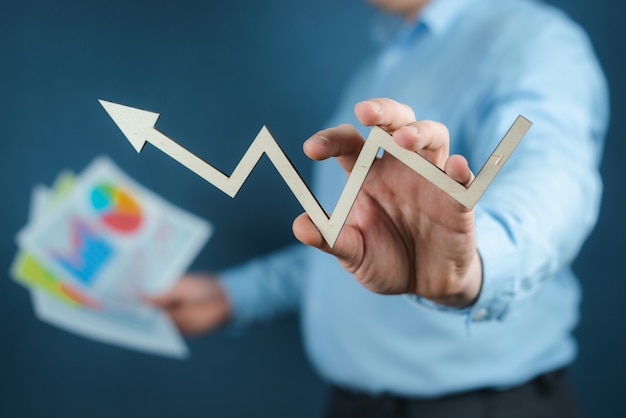 Male hand drawing a graph