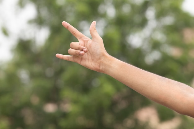 Male hand gesture rock sign