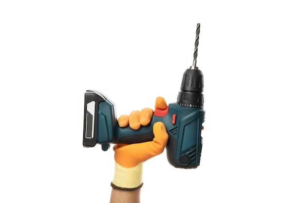 Male hand holds cordless drill, isolated on white