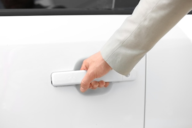 Male hand opening car door