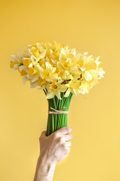 male hand with a bouquet of flowers