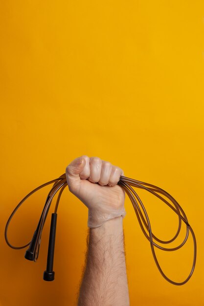 Male hand with skipping rope