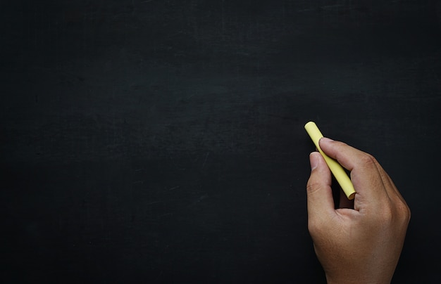 Male Hand Writing on Empty Blackboard Copy Space