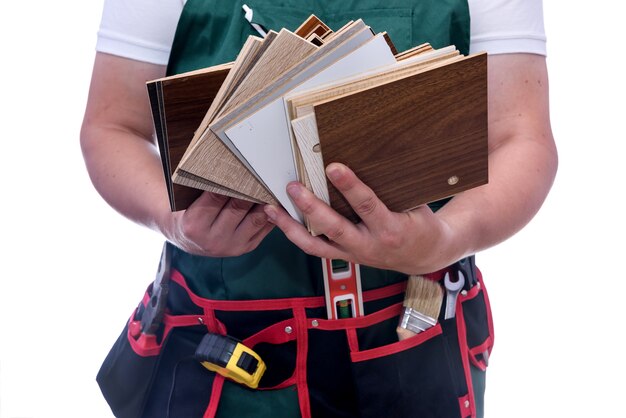 Male hands holding wooden sampler close up