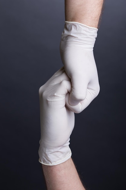 Male hands in latex gloves