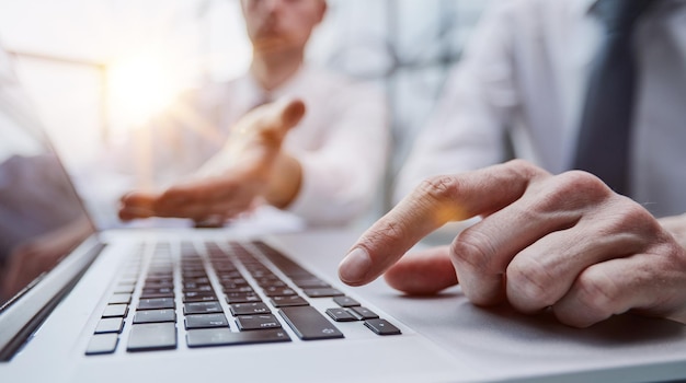 Male hands or men office worker typing on the keyboard