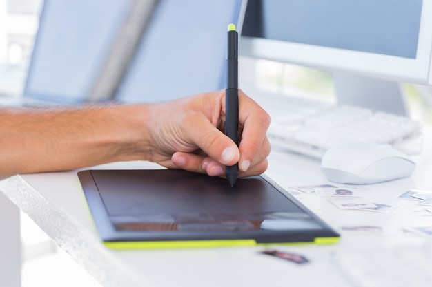 Male hands using graphics tablet