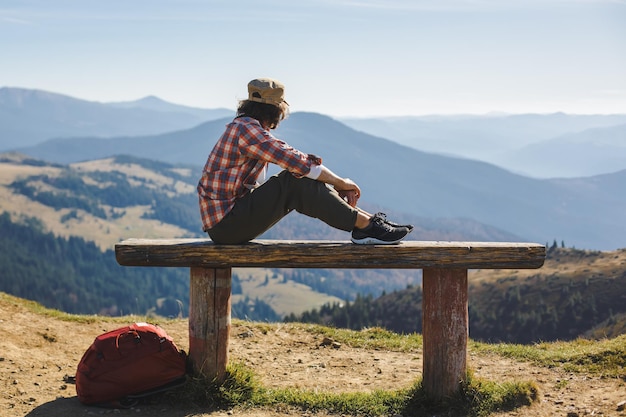 Male hiker resting on top of the mountain