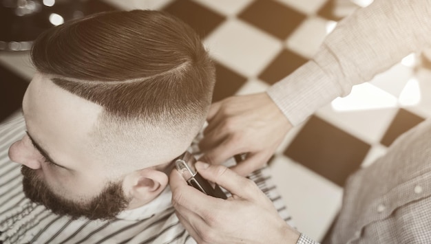 Male hipster in barbershop