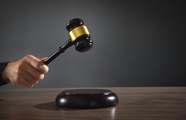 Male judge in a courtroom striking the gavel