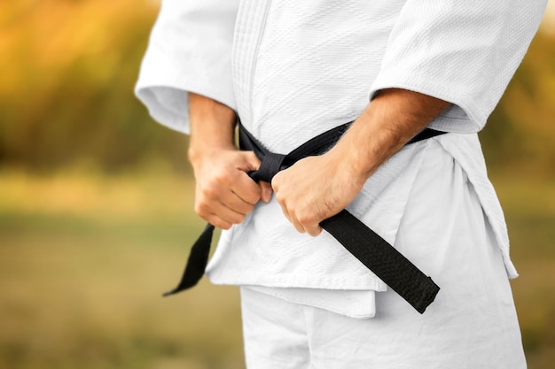 Male karate instructor outdoors closeup