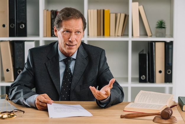 Male lawyer having discussion in the court room