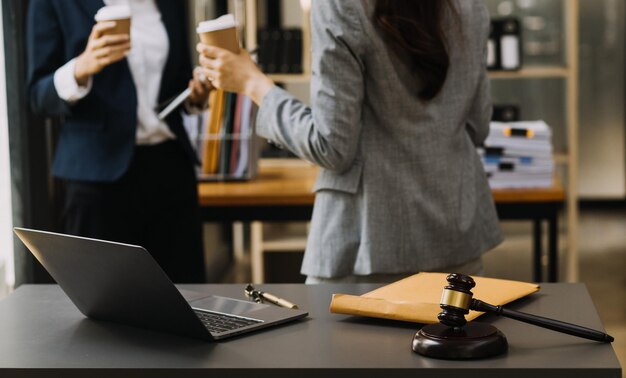 Male lawyer working with contract papers and wooden gavel on tabel in courtroom justice and law attorney court judge concept