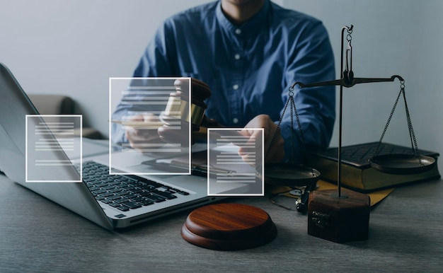 Male lawyer working with contract papers and wooden gavel on tabel in courtroom justice and law attorney court judge concept