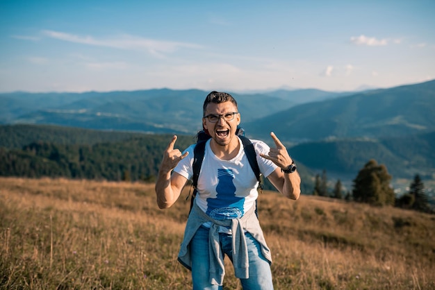 Male man traveler on the background of the Caucasian mountains