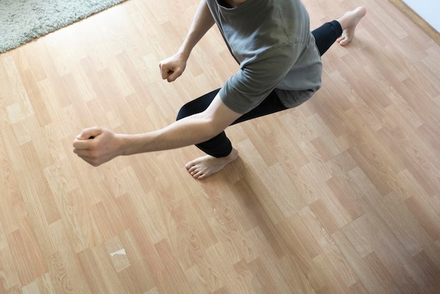 A male person doing some fitness exercise activity at home