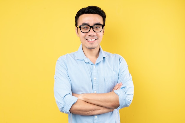 Male portrait wearing shirt, isolated on yellow background