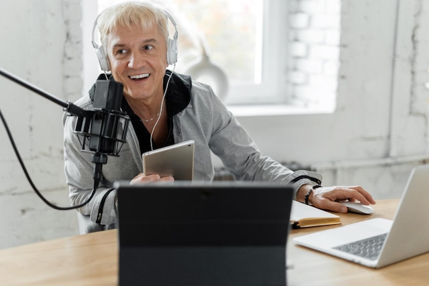 The male presenter works on the radio online communication broadcast Workplace in the studio 