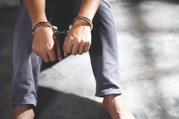 Male prisoner in handcuffs