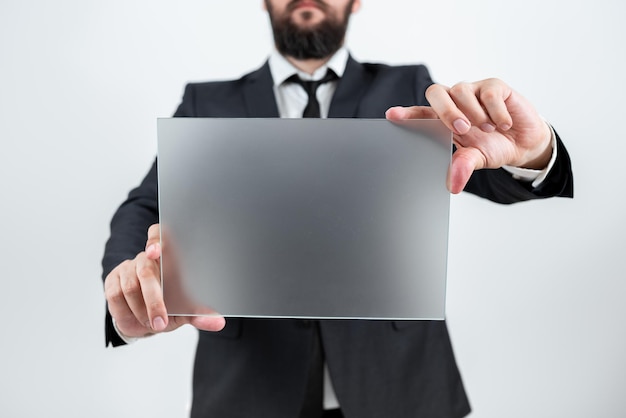 Male Professional Holding Blank Placard And Displaying Business Data Businessman Wearing Suit Showing Rectangular Board For Marketing And Advertising The Company