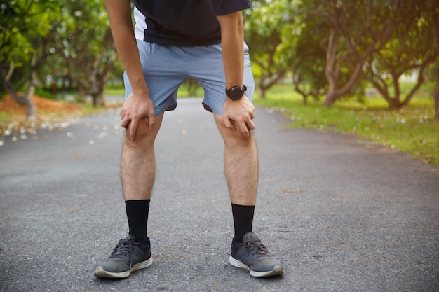 Male runner athlete knee injury and pain