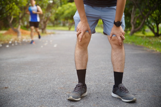 Male runner athlete knee injury and pain