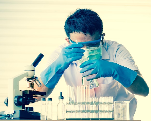 Male scientist experimenting in laboratory