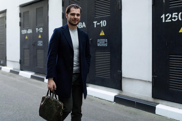 Male sole proprietor heading to work with a briefcase in his hands