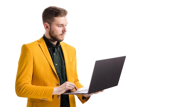 Male standing with wireless laptop