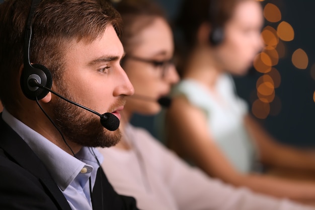 Male technical support agent working in office