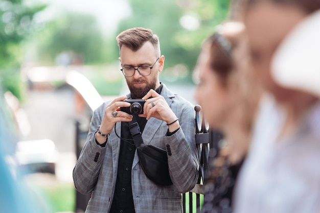 Male tourist is viewing a photo on his camera