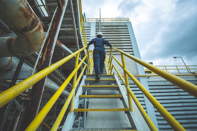 Male walking up the stairway inspection visual in factory