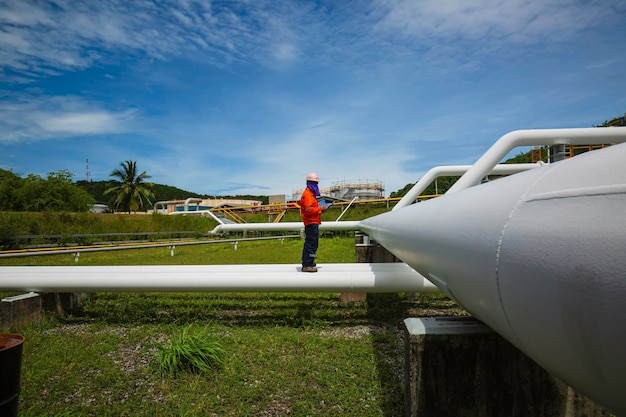 Male worker inspection at valve of visual check record pipeline oil and gas