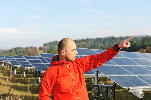 Male worker at solar panel field