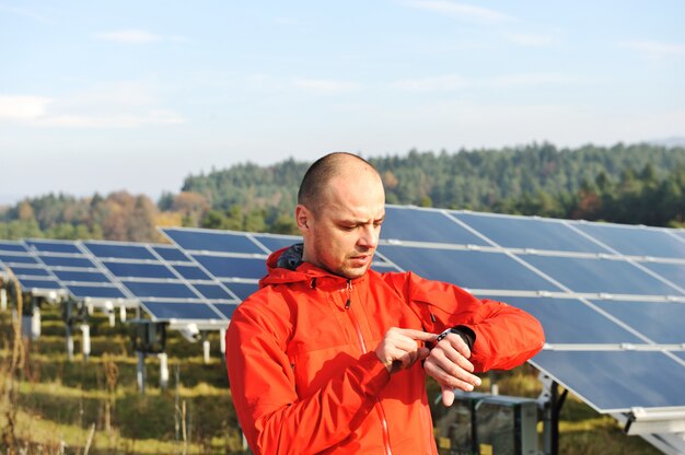 Male worker at solar panel field