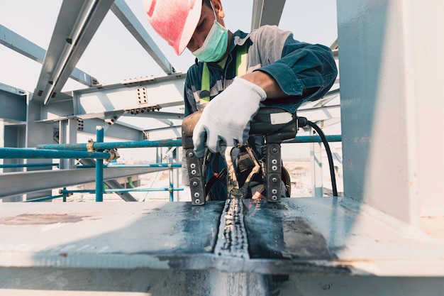 Male worker test structure butt weld beam carbon background white contrast of magnetic field