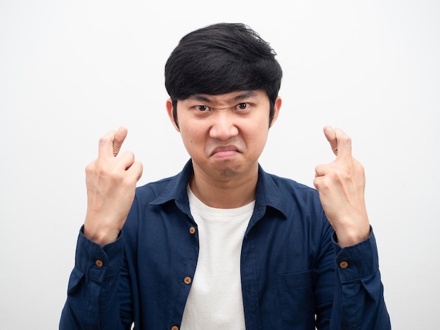 Man angry face corss finger portrait white background head shot,Asian man not satisfied