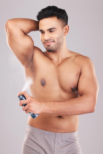 Man armpit hygiene and body skincare perfume for healthy lifestyle grooming Happy person clean natural wellness and underarm dermatology deodorant spray treatment after shower in studio background