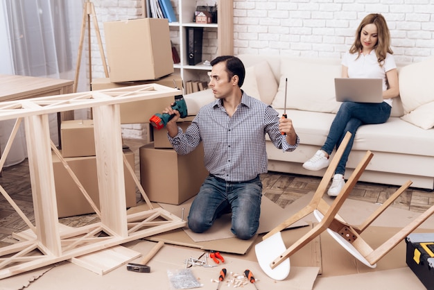 Man Assemble Furniture Folds New Furniture out Box