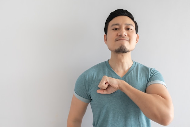 Man bang his fist on his chest as a sign of confidence.