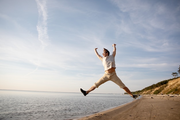 the man on the beach is hiding high and fooling around