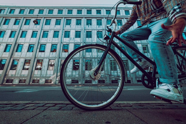 Man on the bike with building in the background